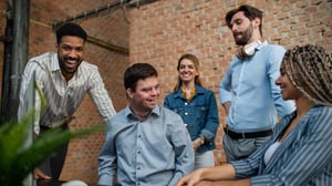 diverse group of coworkers laughing with each other