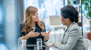 Two professional women conversing.